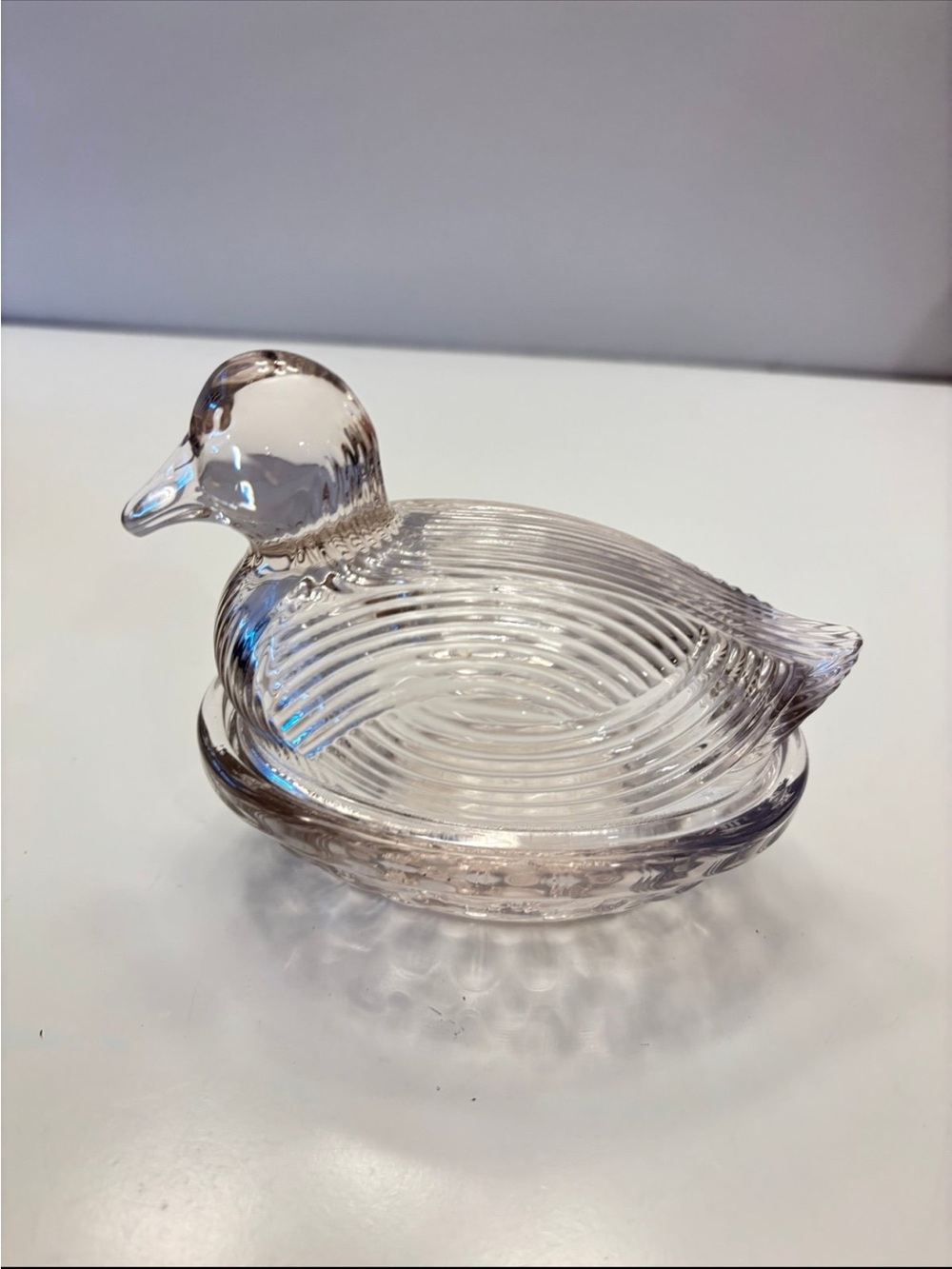 Light pink glass basketweave duck on a nest